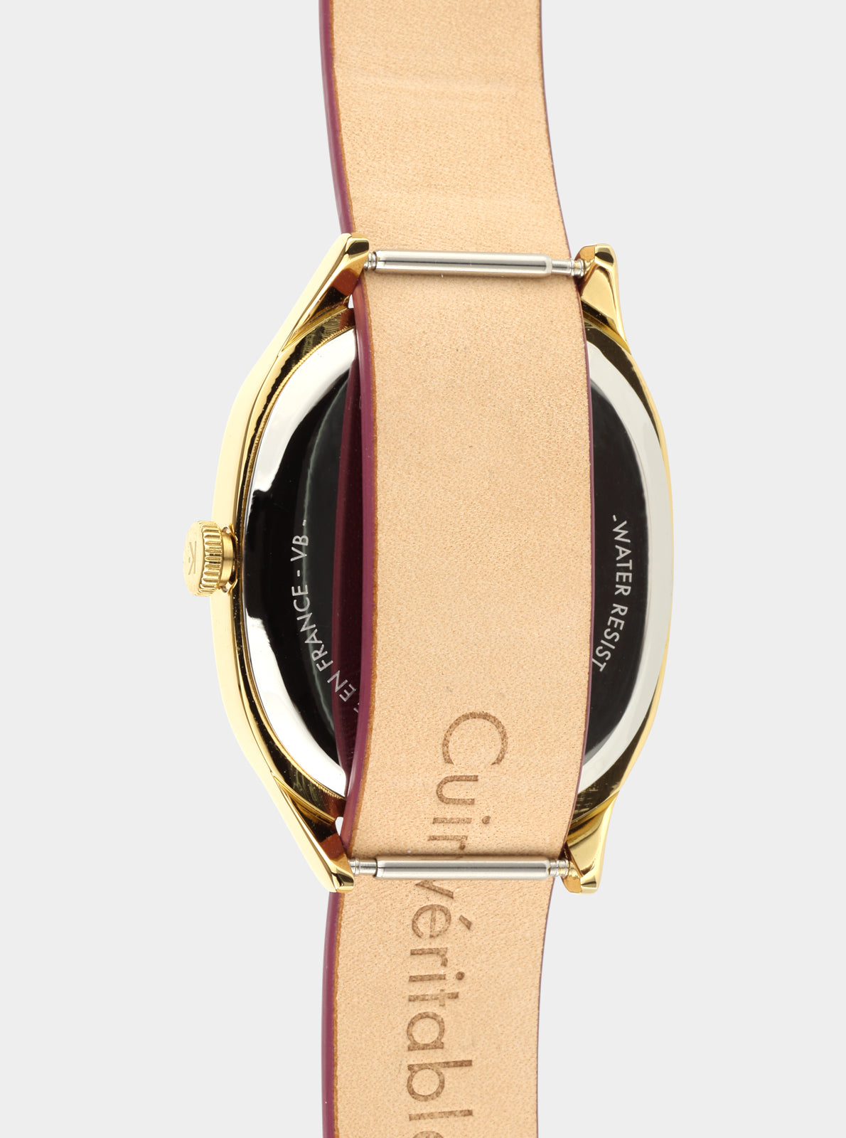 Image of Dos de montre Kelton sur bracelet cuir prune, marquage 'WATER RESIST'.