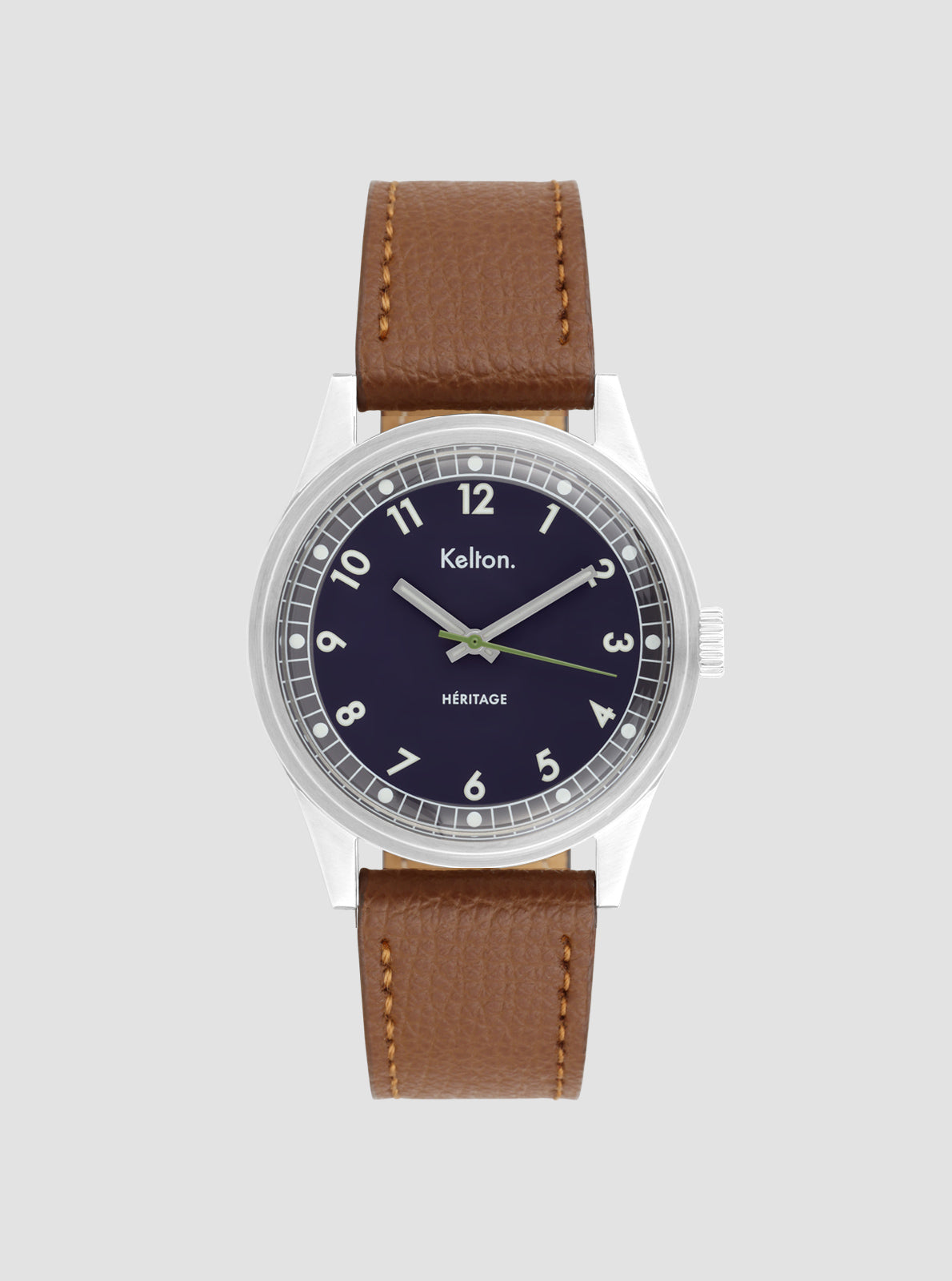 Image of Montre à cadran bleu nuit et bracelet en cuir camel, boîtier argenté.