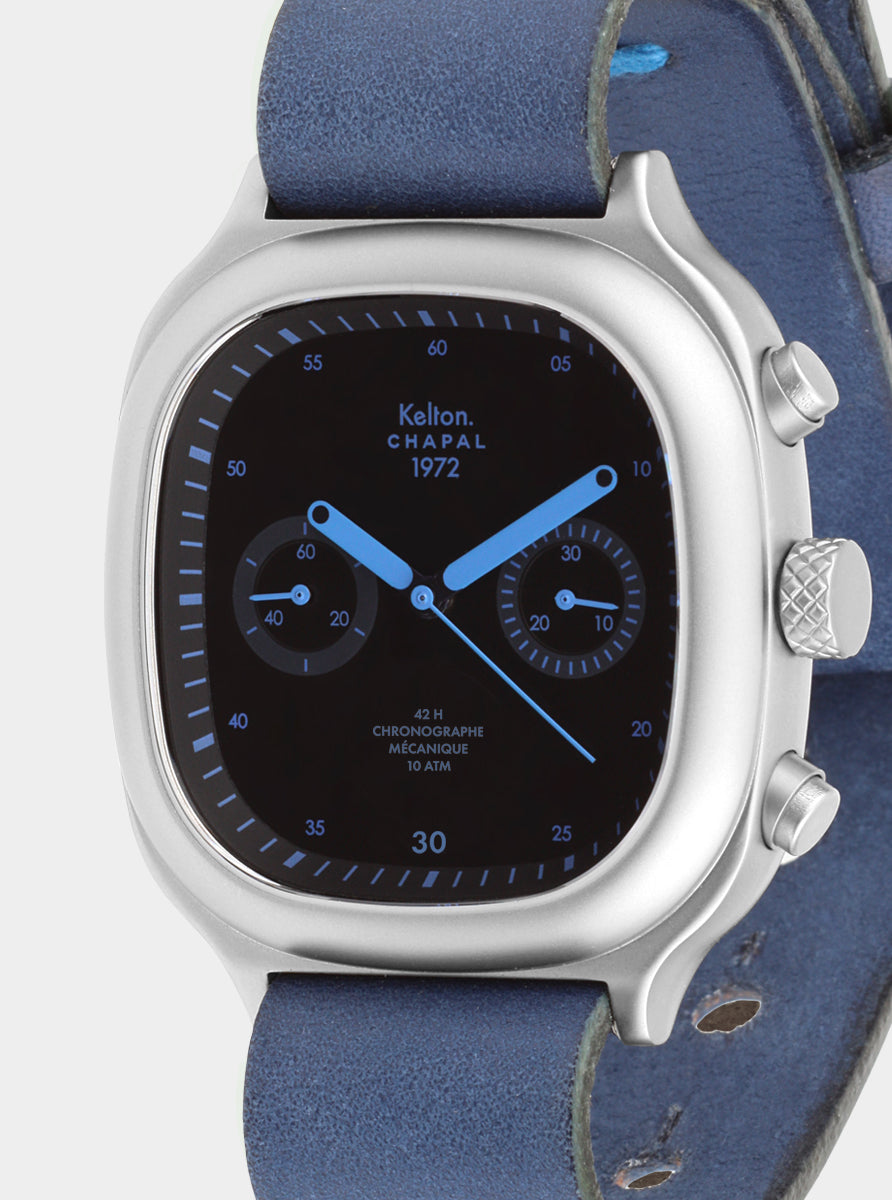 Image of Montre chronographe Kelton Chapal, bracelet bleu ciel et cadran noir avec index et chiffres.
