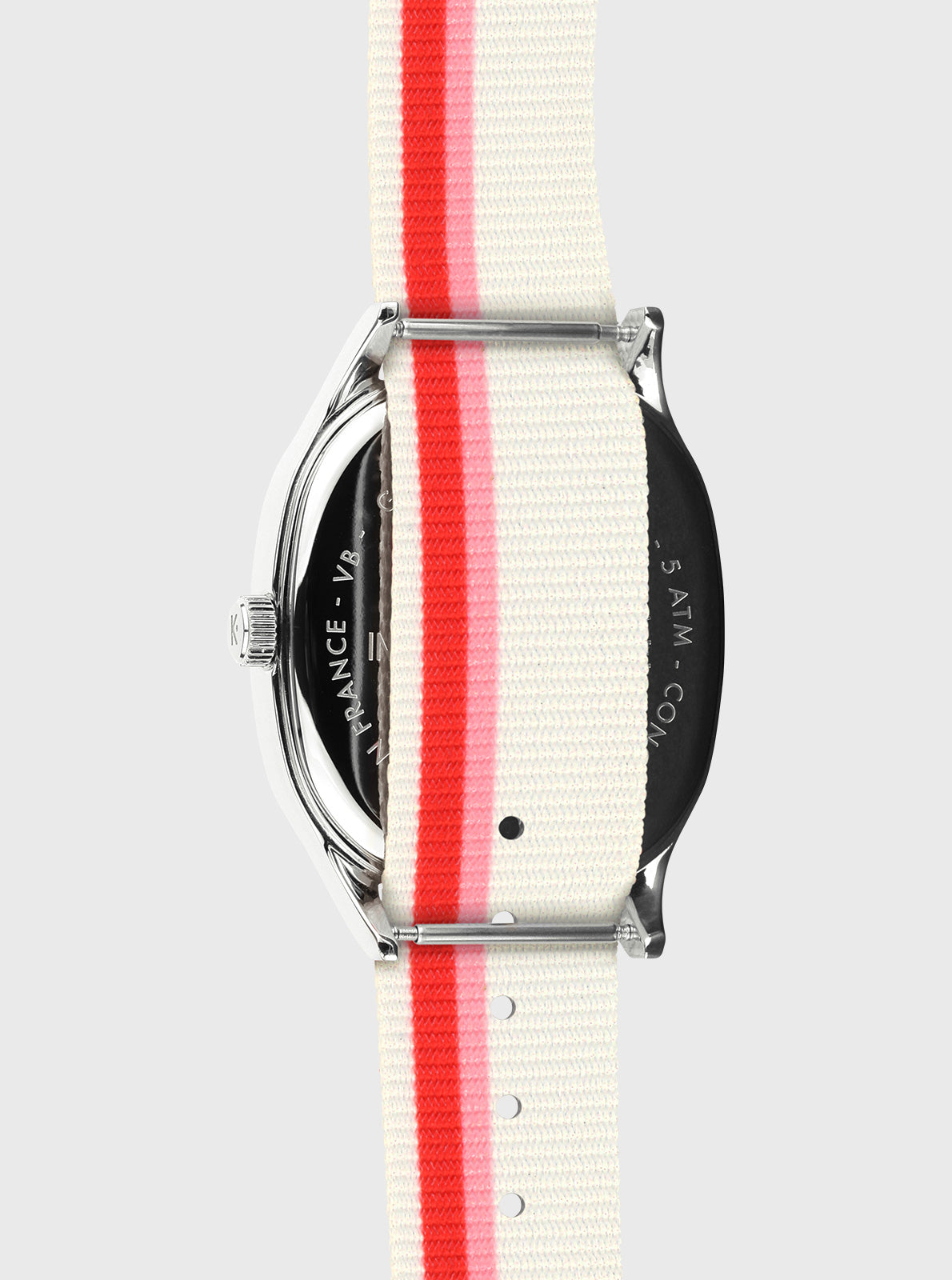 Image of Montre bracelet textile rayé blanc et rouge, vue de profil boîtier argenté