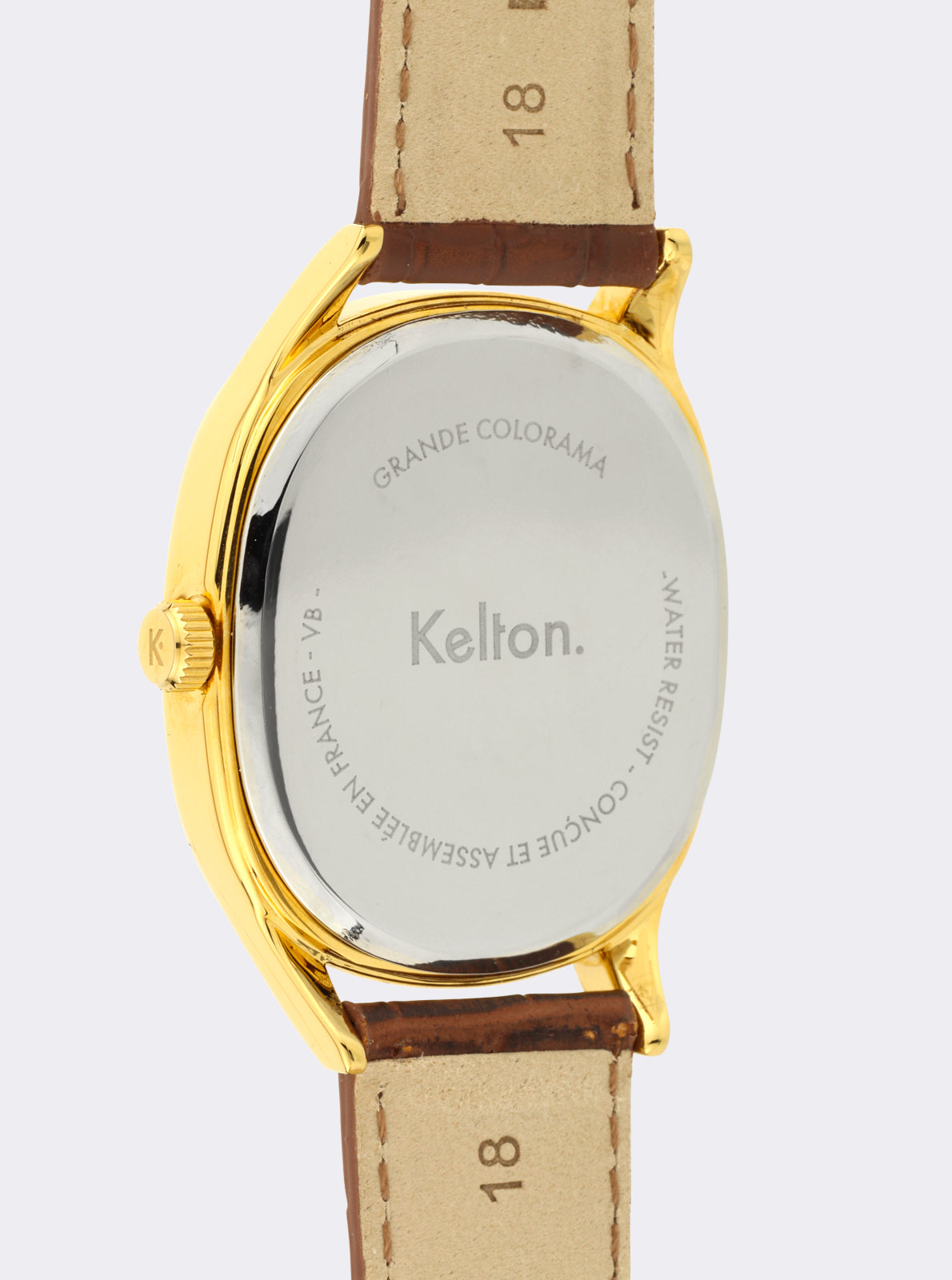 Image of Montre dorée : fond gravé Grande Colorama et Kelton, bracelet en cuir brun.