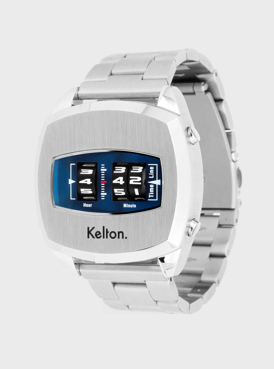 Image of Montre à bracelet métallique argenté, boîtier rectangulaire et cadran bleu vue de côté.