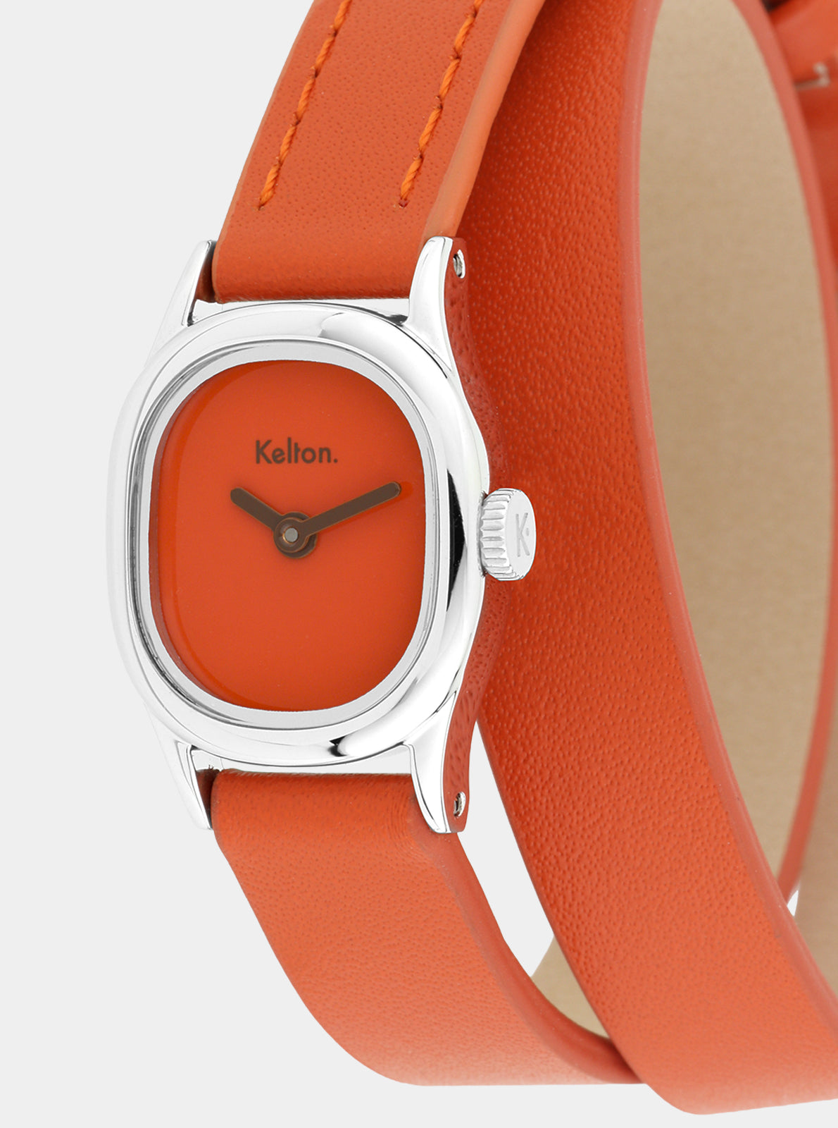 Image of Montre Kelton Minicolo cadran orange et bracelet cuir mandarine, vue rapprochée du boîtier.